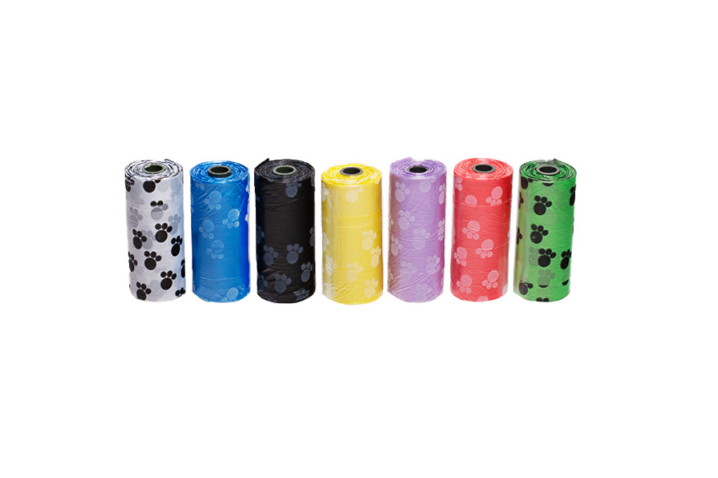 Sports Furnatic's, seven, dog poop bag, colors lined up in a row, on white background. White, Blue, Black, Yellow, Purple, Red, and Green Dog Poop Bags.