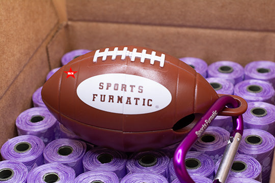 Sports Furnatic's dispenser laying on a bed of bag rolls called Season BAG Holder as a play on words 'Season Ticket Holder.'