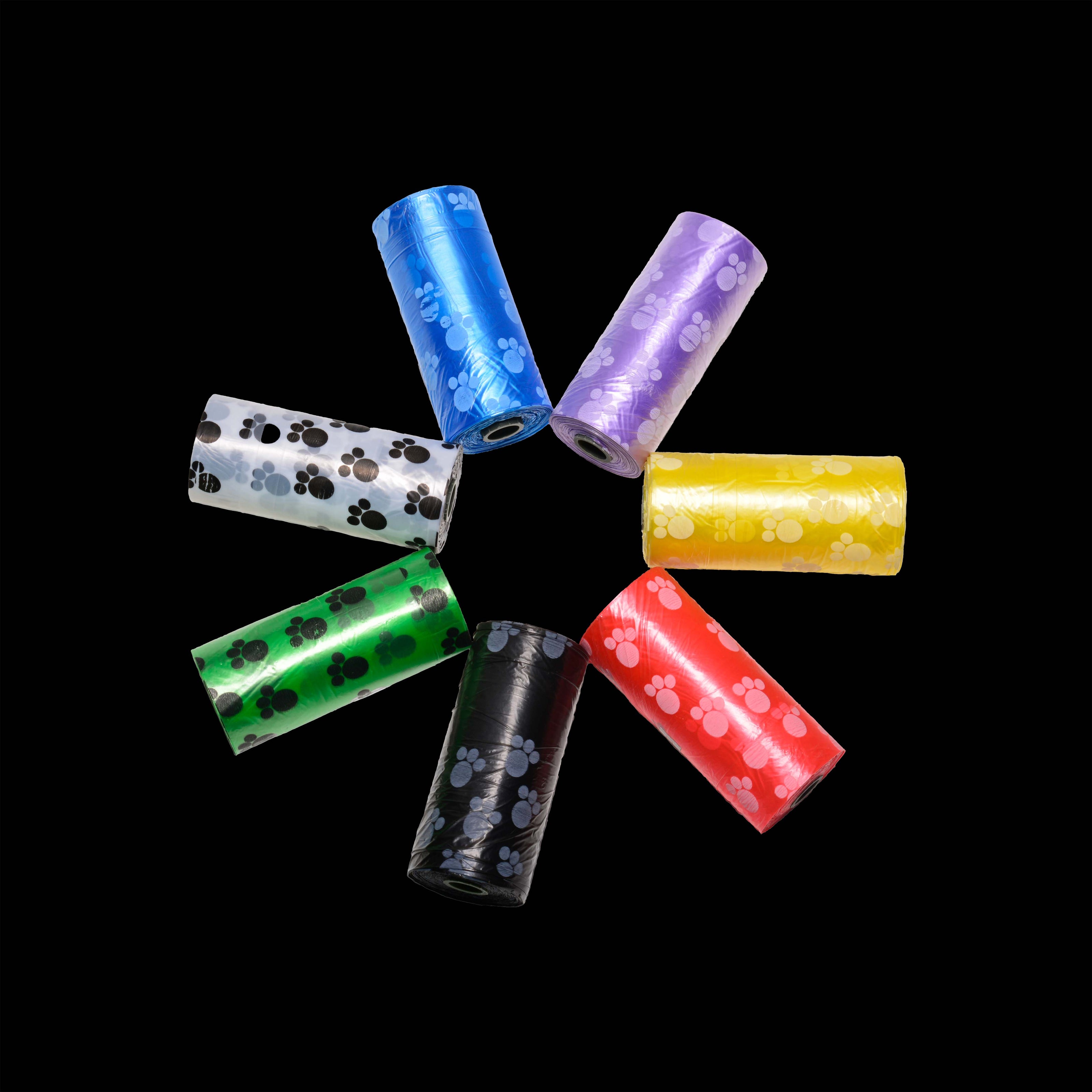 The Tail Gater's 7 bag roll color options. The rolls are in the shape of a star.  Shown on a black background